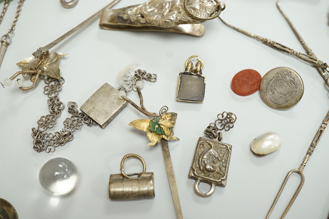 A collection of Chinese Straits white metal hooks, a chatelaine, South East Asian coinage and other items, etc.
